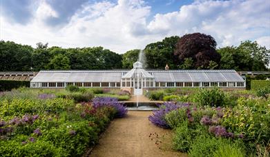 The large greenhouse and gardens at Scampston Hall & Gardens in East Yorkshire.