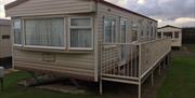 A static caravan exterior and decking area at Thornwick Bay Private Hire Caravan in East Yorkshire.