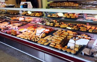 The glass counters full of sausage rolls, pies, scotch eggs and other meat and bakery produce at A Laverack & Son Butchers and Bakers, in East Yorkshi