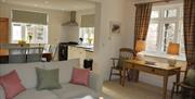 An open plan living room, kitchen and diner at the Clitherow Cottage at estate escapes in East Yorkshire.