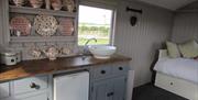 The kitchen and sleeping areas in side a hut at West Hale Gale Glamping in East Yorkshire.
