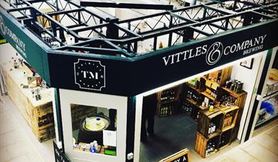 An image taken of the exterior of Vittles & Company shop inside Hulls trinity indoor food hall and market.