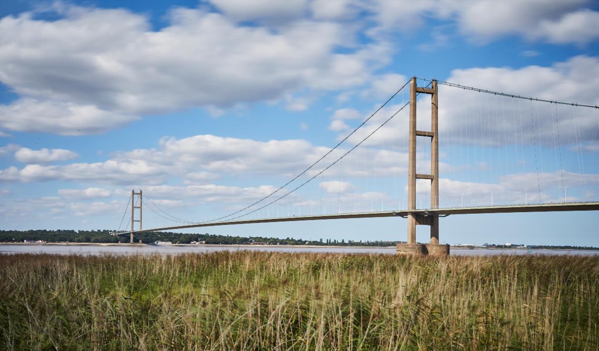 The humber bridge taken from the foreshores looking out across water, in East Yorkshire