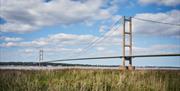 The humber bridge taken from the foreshores looking out across water, in East Yorkshire