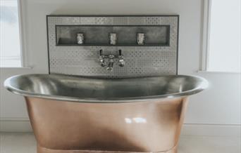 An image of the feature bath tub at Manor Farm Country Cottages.