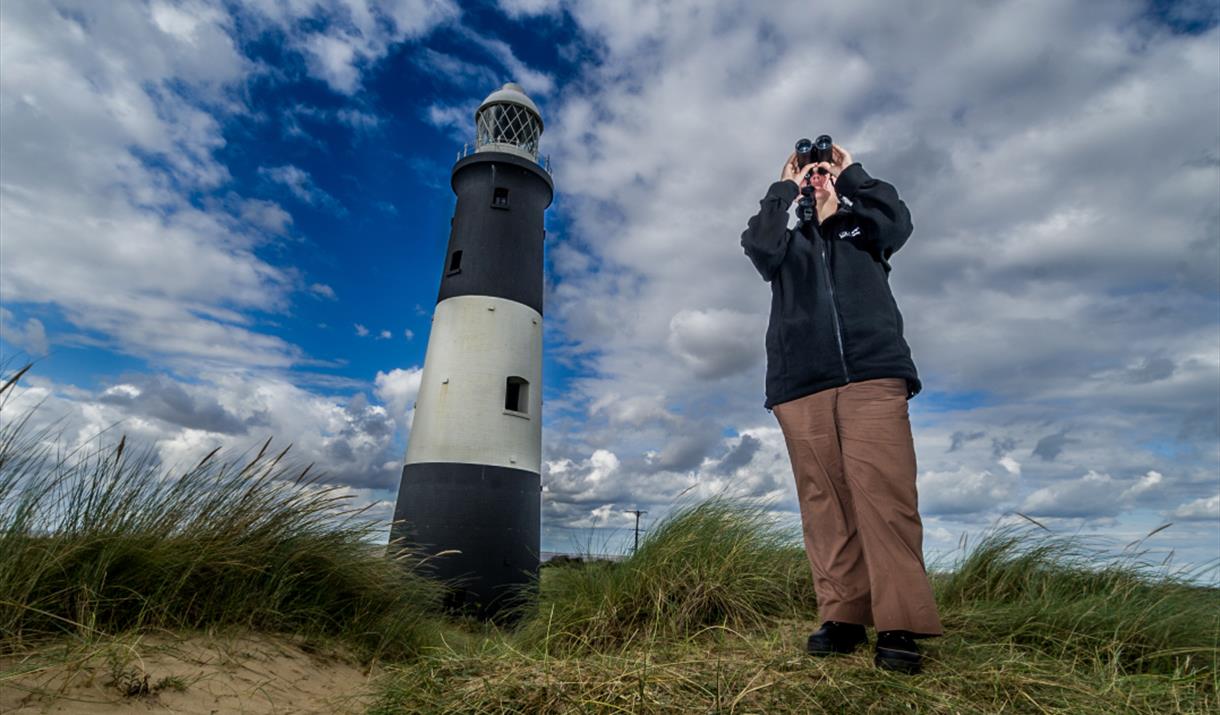 Birdwatching at Spurn Point lighthouse, East Yorkshire