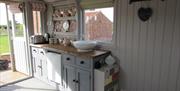 The kitchen area inside a hut at West Hale Gate Glamping in East Yorkshire.