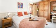 An image of a bedroom in Ostler's Corner at Field House Farm Cottages in East Yorkshire.