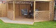 The garden area, with pergola, at Travellers Rest Apartment, Beverley, East Yorkshire