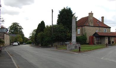 The memorial at the crossroads in Hotham, East Yorkshire.