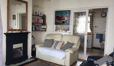 The living area, looking through to the kitchen at Pebble Cottage, Bridlington, East Yorkshire.