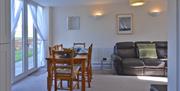 Lounge Diner with Patio Doors to the Rear at Sunset Cottage, Bridlington, East Yorkshire