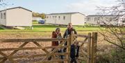 A family setting off on a walk from the static caravan area at South Cliff Holiday Park, Bridlington, East Yorkshire
