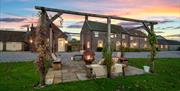 The outdoor seating area including firepit, taken at sunset at Broadgate Farm Cottages, Walkington, East Yorkshire.