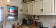 The kitchen and cooking space at pebble cottage, Bridlington, East Yorkshire.
