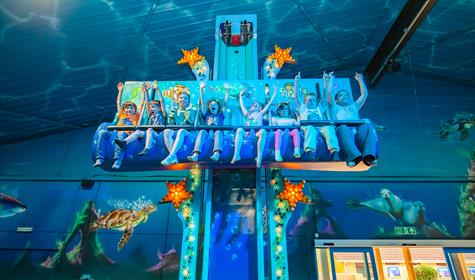 a group of young riders enjoying a sea life themed ride at crealy theme park