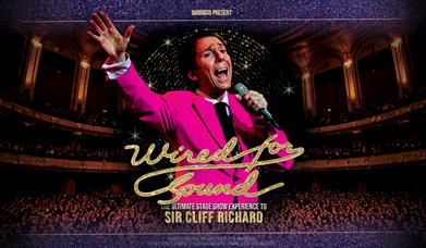 Wired for Sound - The Ultimate Cliff Richard Experience Babbacombe Theatre imaged of a Cliff Richard Impersonator on stage