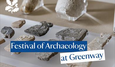Shards of pottery displayed on a perspex stand with a text box that reads "Festival of Archaeology at Greenway"