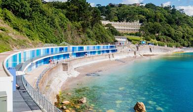 Blue beach huts at Meadfoot beach in Torquay, Devon