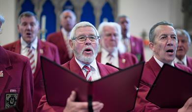 Brixham Orpheus Male Voice Choir Annual Concert St Mary's Square Brixham male singers inside a church