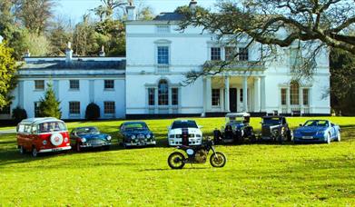 Classic vehicles parked in front of Lupton House, Brixham, Devon