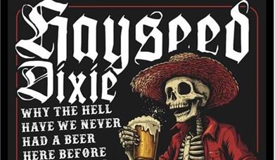 Hayseed Dixie Arena Torquay laughing skeleton in a straw hat with a glass of beer