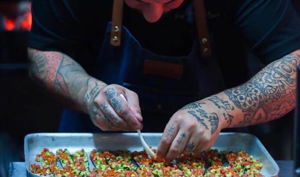 Chef preparing, Loluli’s pop up Fish Over Fire at Otto