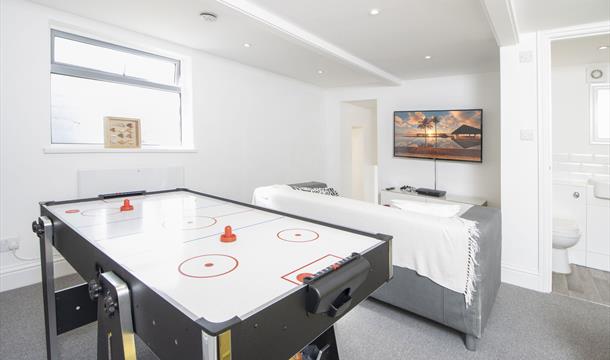 The Games Room, with flip-over pool table and air hockey