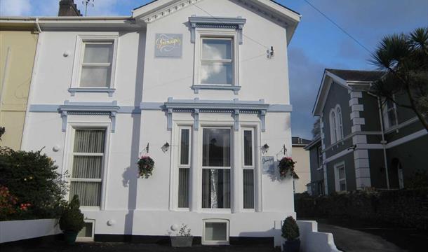 Front of house and car park area at Serendipity Guest House, Torquay, Devon