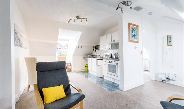 Atherfield Holiday Apartments, kitchen and sitting area with sloping ceiling