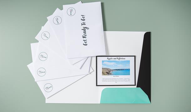 Surprise Trip Pack laid out with all the envelopes