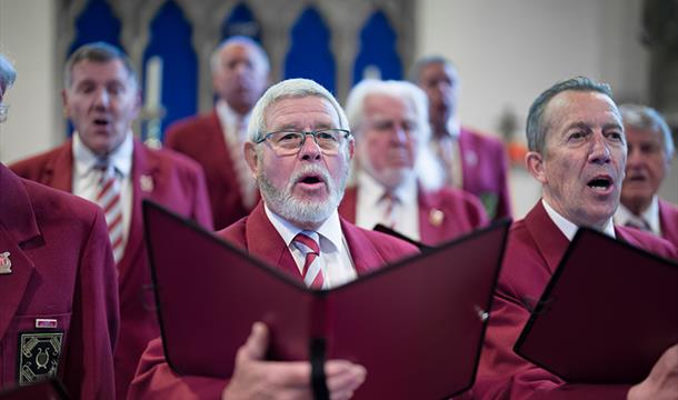 Brixham Orpheus Male Voice Choir Annual Concert St Mary's Square Brixham male singers inside a church