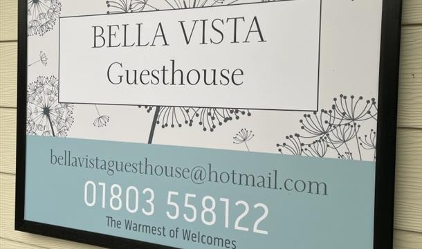 photos of the breakfast hamper, bedrooms, and guest house signage