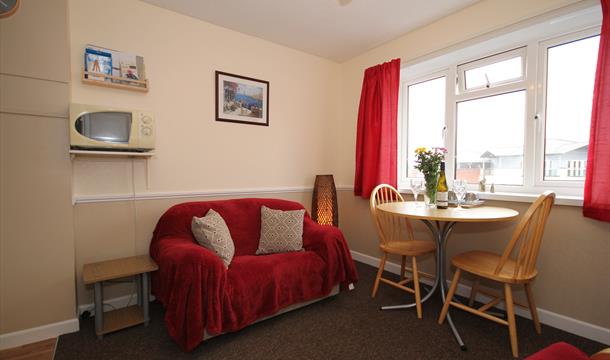 Dining area at Big Tree Holiday Flats, Paignton, Devon