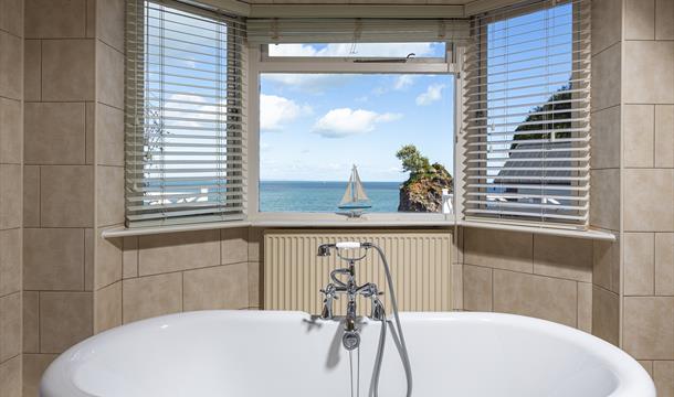 Bathroom with view of yacht at Cary Arms & Spa