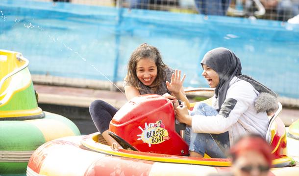 Two young girls enjoying a water ride at crealy theme park