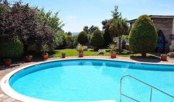 Outside swimming pool at The Templestowe Hotel, Torquay, Devon