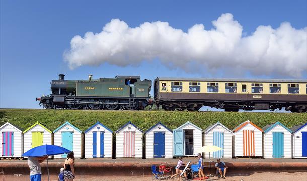 Steam locomotive Goliath over the beach huts at Goodrington Sands