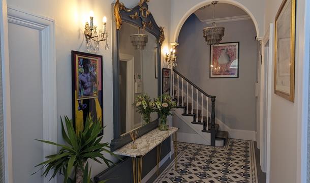 Hallway with contemporary artwork and beautiful tiles flooring.