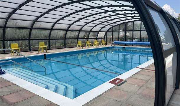 Outdoor pool with enclosure at Landscove Holiday Park