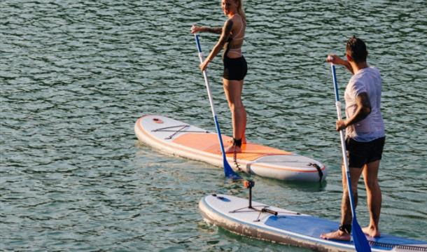 Two stand up paddle boarders, hired from the Osborne Hotel