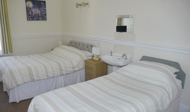 Bedroom at Broadshade Holiday Flats, Paignton, Devon