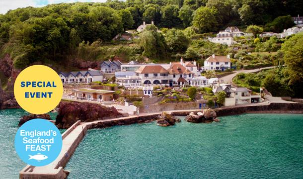 A view looking across the water to Cary Arms & Spa, with the pier in the foreground. Part of England's Seafood FEAST.