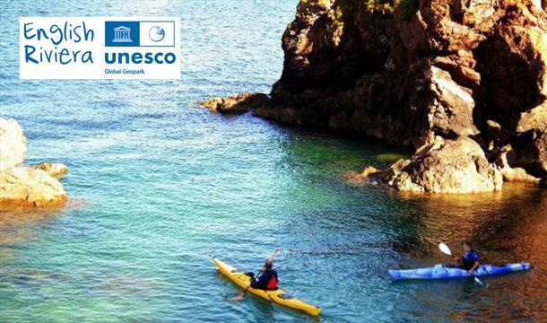 Kayakers in the sea, English Riviera UNESCO Global Geopark.