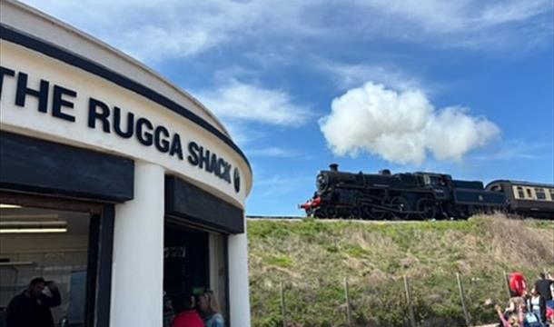Exterior of Rugga Shack with the steam train in the background
