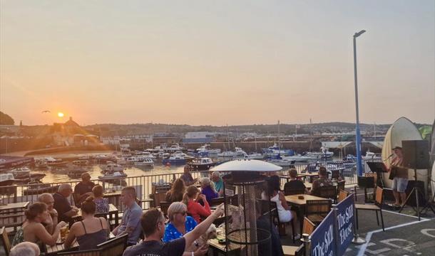 Outside seating at The Still House, Paignton Harbour, Paignton, Devon