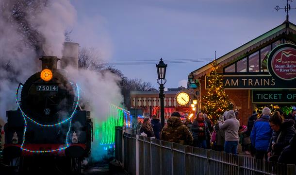 Train of Lights steam locomotive boarding customers at Queen's Park Station.