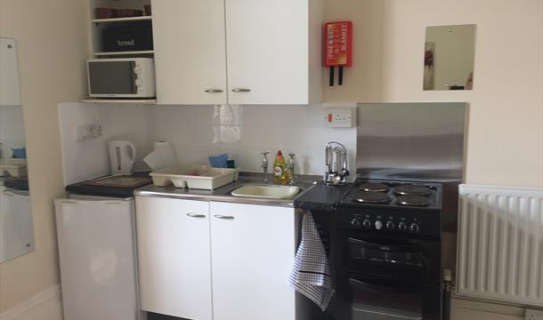 Kitchen area at Adelphi Holiday Apartments in Paignton, Devon