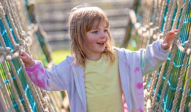young girl enjoying the playground at crealy theme park