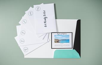 Surprise Trip Pack laid out with all the envelopes